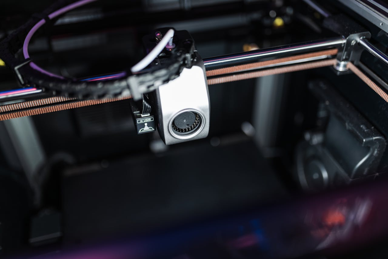 Detailed image showcasing the intricate components of a high-tech 3D printer in action.