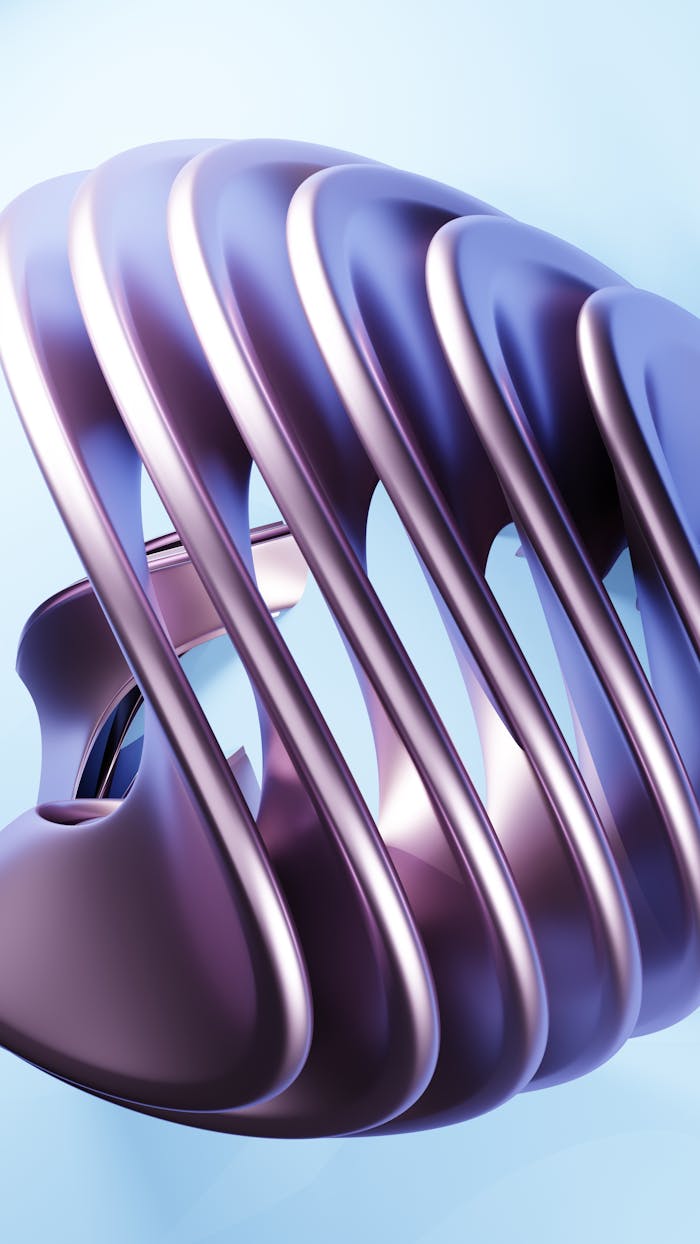 Futuristic metallic sculpture with smooth curves against a light blue backdrop.